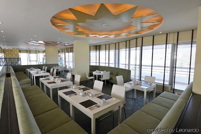 Al Raya Suites Hotel Манама Ресторан фото